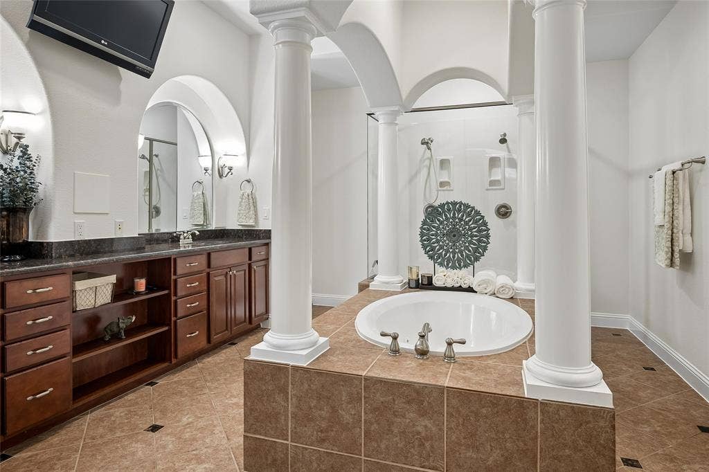 The primary bathroom is over the top!