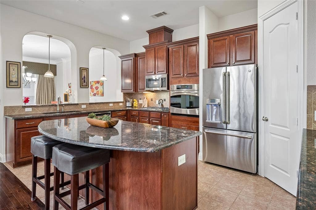 A big walk-in pantry and plenty of cabinets  provide lots of storage.