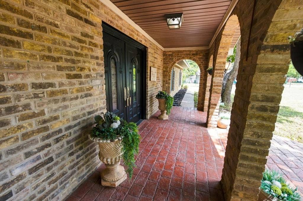 612 W Highland Street, West, TX 76691 Beautiful covered front porch protecting the entryway from the circle drive in front of the home