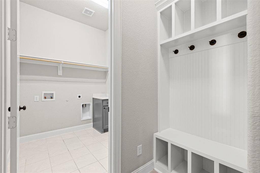 3200 Tail Water Drive, Mansfield, TX 76063 Mudroom is by the laundry room which connects to one of the primary closets.