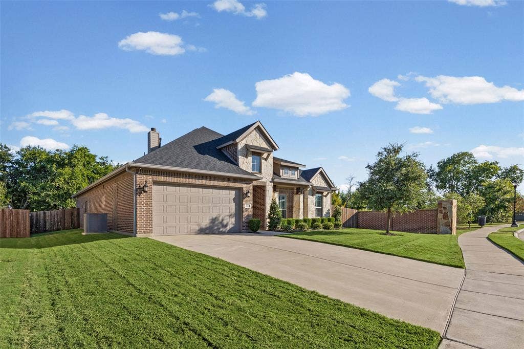 3200 Tail Water Drive, Mansfield, TX 76063 Great curb appeal with only one next door neighbor and green space behind