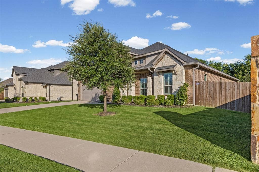 3200 Tail Water Drive, Mansfield, TX 76063 Great curb appeal with only one next door neighbor and green space behind
