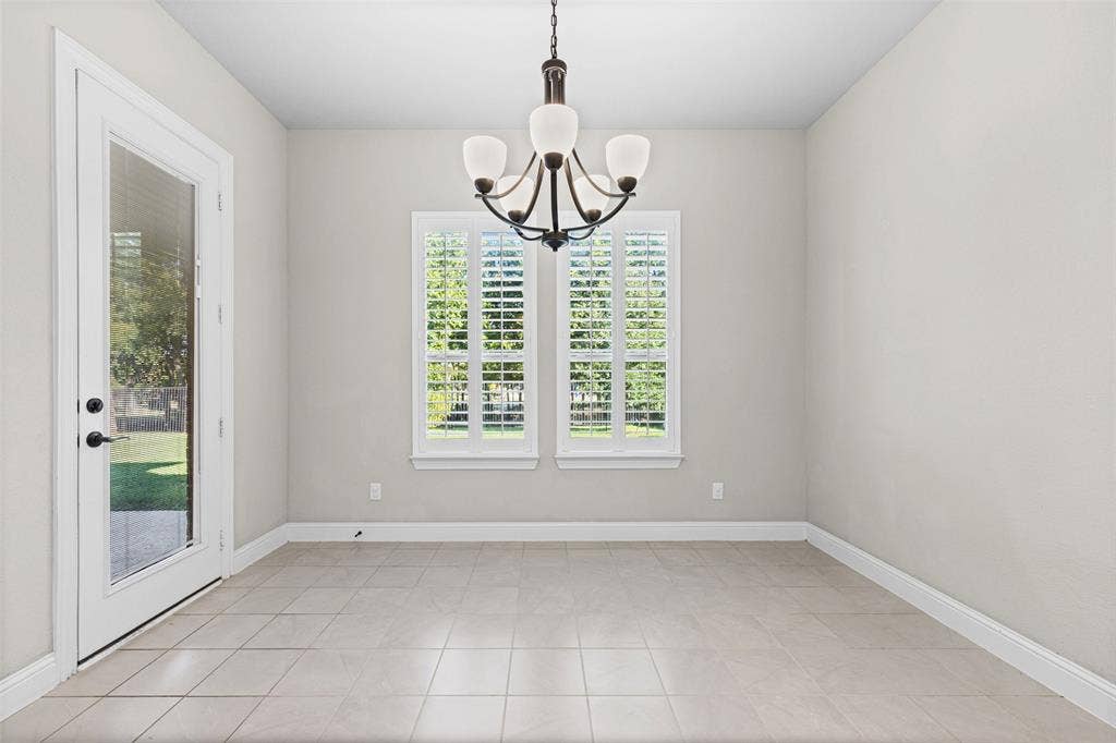 3200 Tail Water Drive, Mansfield, TX 76063 The light and bright breakfast room has a door to the covered patio