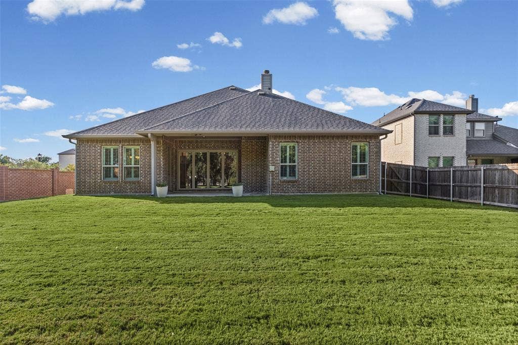 3200 Tail Water Drive, Mansfield, TX 76063 Large covered patio with sliding glass doors