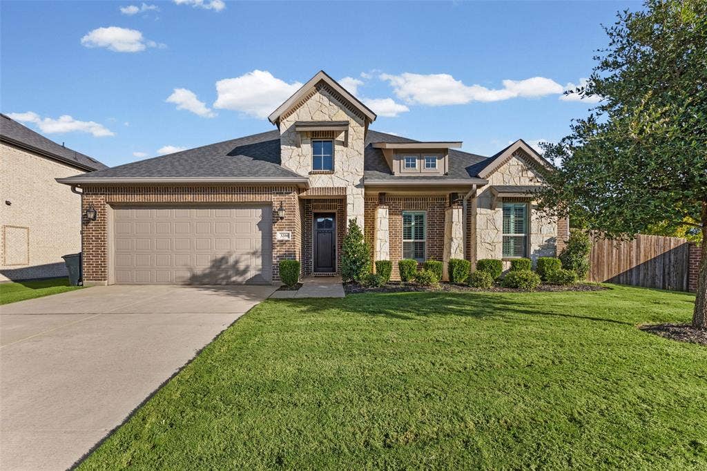 3200 Tail Water Drive, Mansfield, TX 76063 Great curb appeal with only one next door neighbor and green space behind