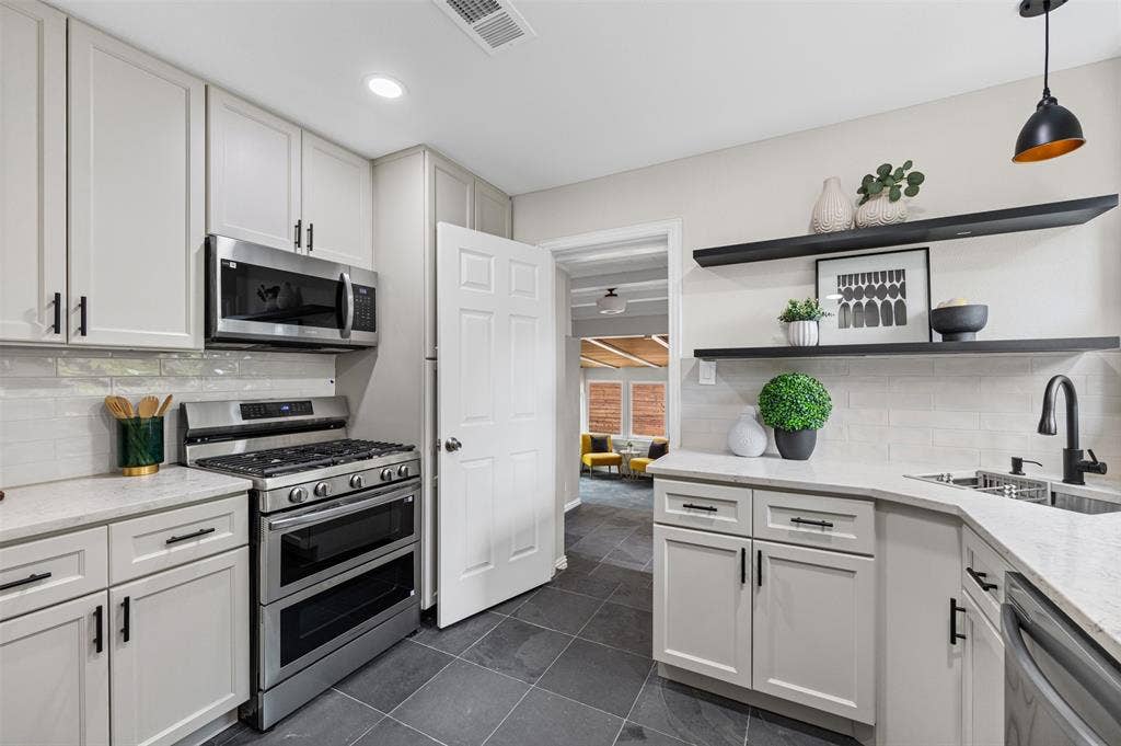 311 N Tennant Street, Dallas, TX 75208 Updated kitchen leading to bedroom or living space