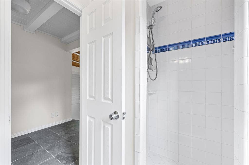 311 N Tennant Street, Dallas, TX 75208 Full bathroom with tile shower