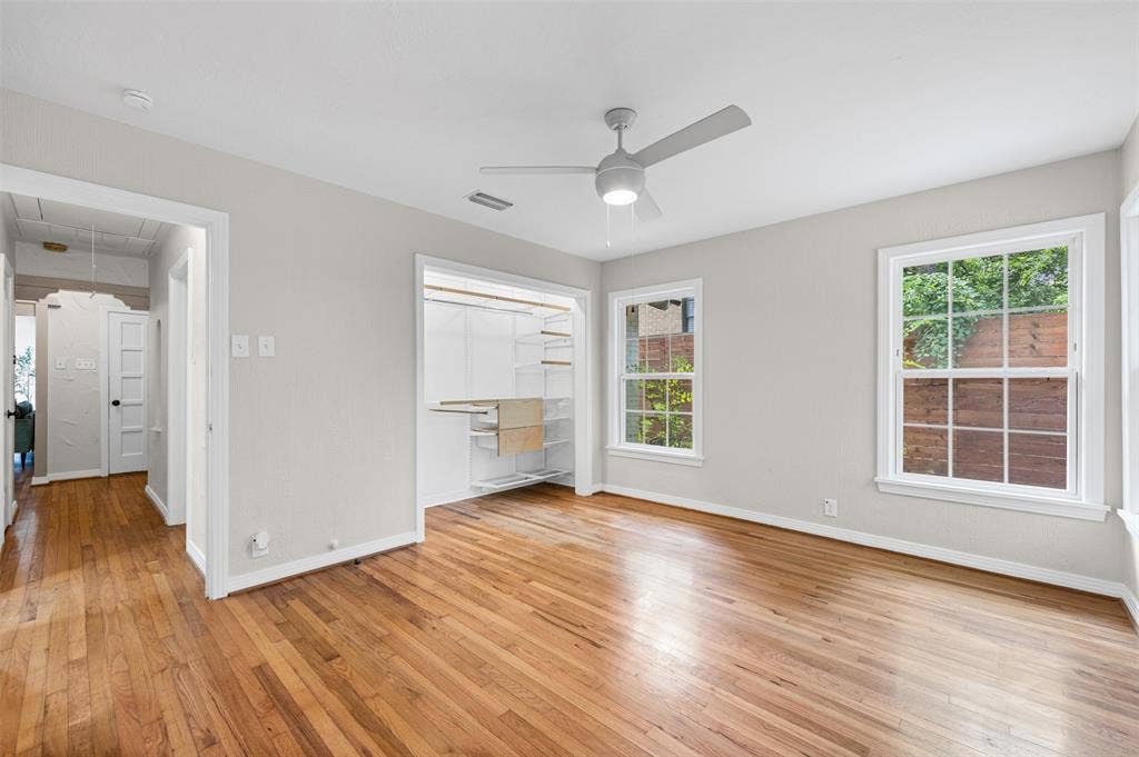 311 N Tennant Street, Dallas, TX 75208 Bedroom with original hardwoods and closet built-ins