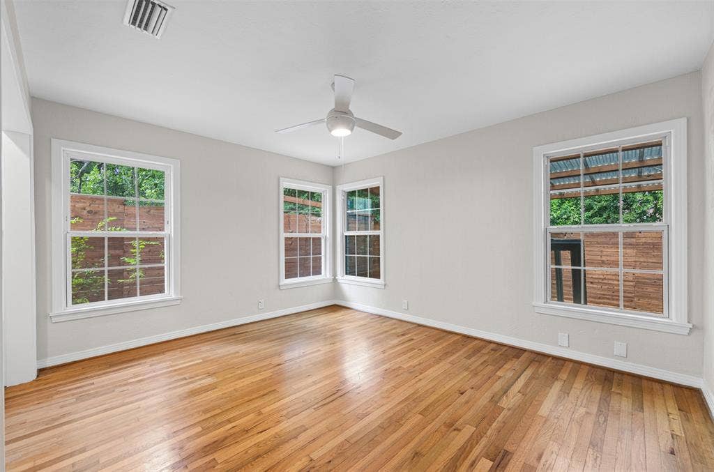 311 N Tennant Street, Dallas, TX 75208 Bedroom with original hardwoods and ceiling fan