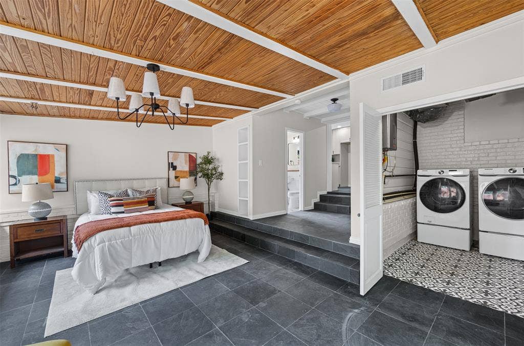 311 N Tennant Street, Dallas, TX 75208 Bedroom with laundry. This room has sliding doors leading to the back patio
