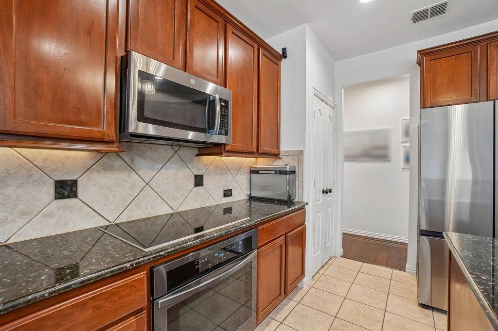 1380 Southern Pines Drive, Rockwall, TX 75087 Stainless steel appliance. Fridge stays