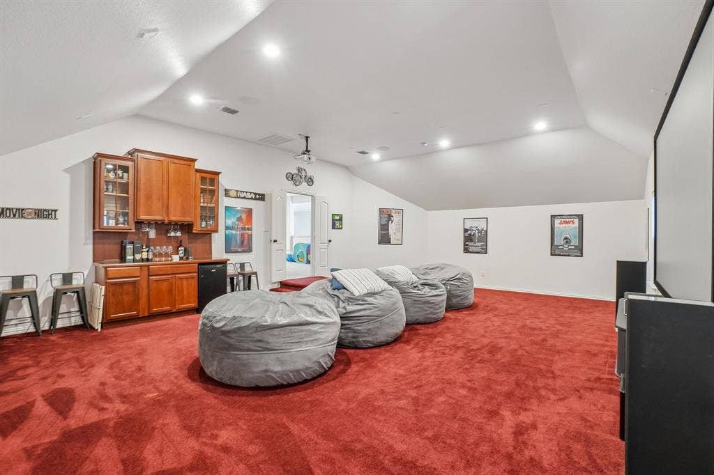 1380 Southern Pines Drive, Rockwall, TX 75087 Media room with built-in cabinets fridge