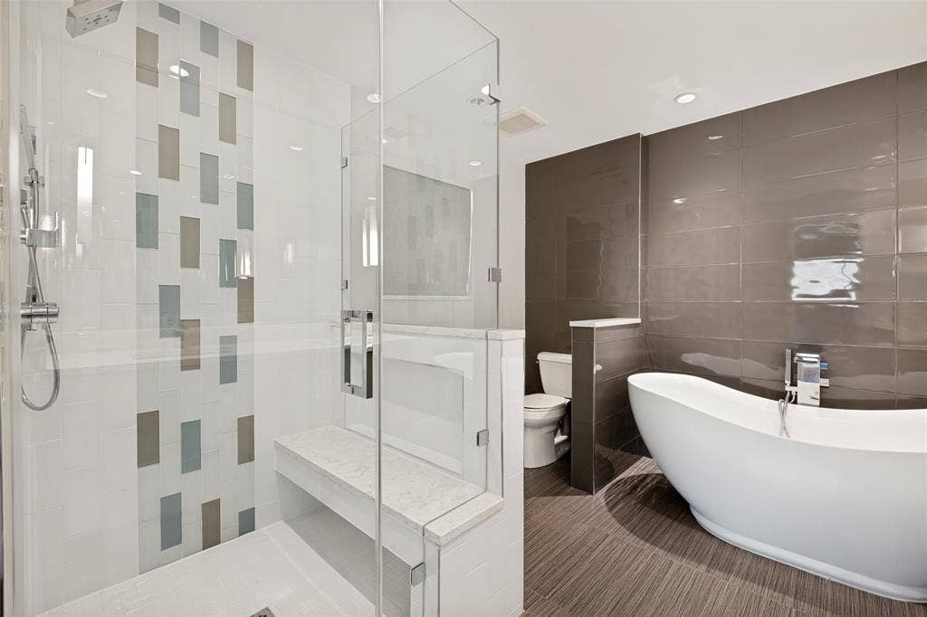 12022 Dixfield Drive, Dallas, TX 75218 Updated primary bathroom featuring a spacious walk-in shower with modern finishes.