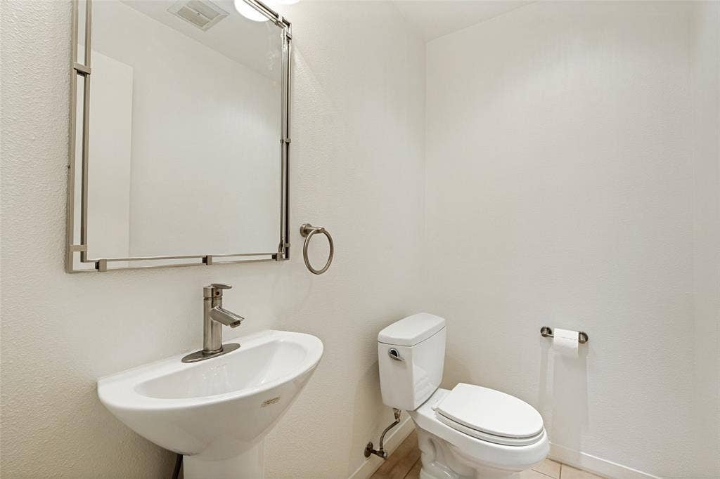 12022 Dixfield Drive, Dallas, TX 75218 Conveniently located downstairs guest half bath.