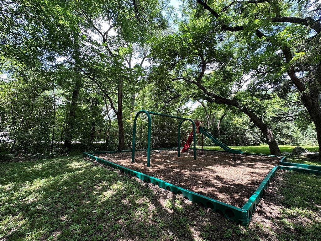 12022 Dixfield Drive, Dallas, TX 75218 Park located across the street, surrounded by beautiful green space.
