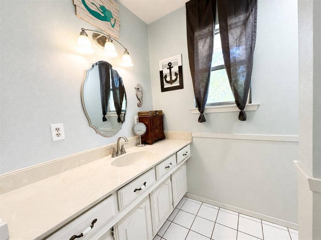 7761 Fm 2494, Athens, TX 75751 Bathroom featuring a white vanity with extensive counter space, an integrated sink, and brushed nickel hardware