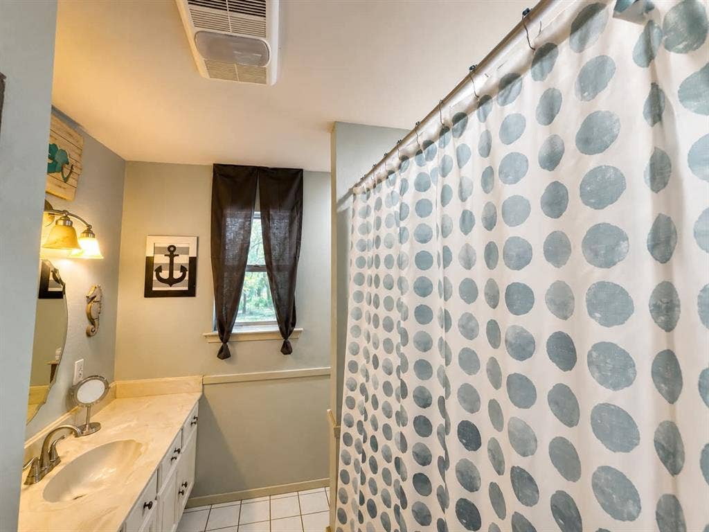 7761 Fm 2494, Athens, TX 75751 Bathroom vanity featuring an integrated sink, polished chrome faucet, and ample under-sink storage