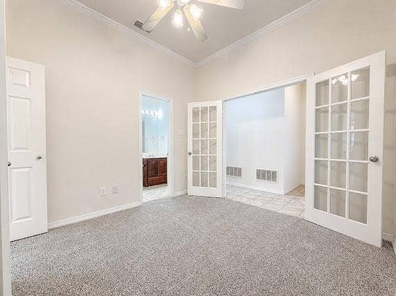 Vaulted ceiling with crown molding and ceiling fan