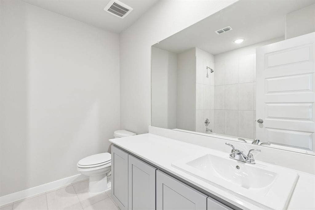 1908 Kentucky Trail, Seagoville, TX 75159 Bathroom in the Haylee home plan by Trophy Signature Homes - REPRESENTATIVE PHOTO