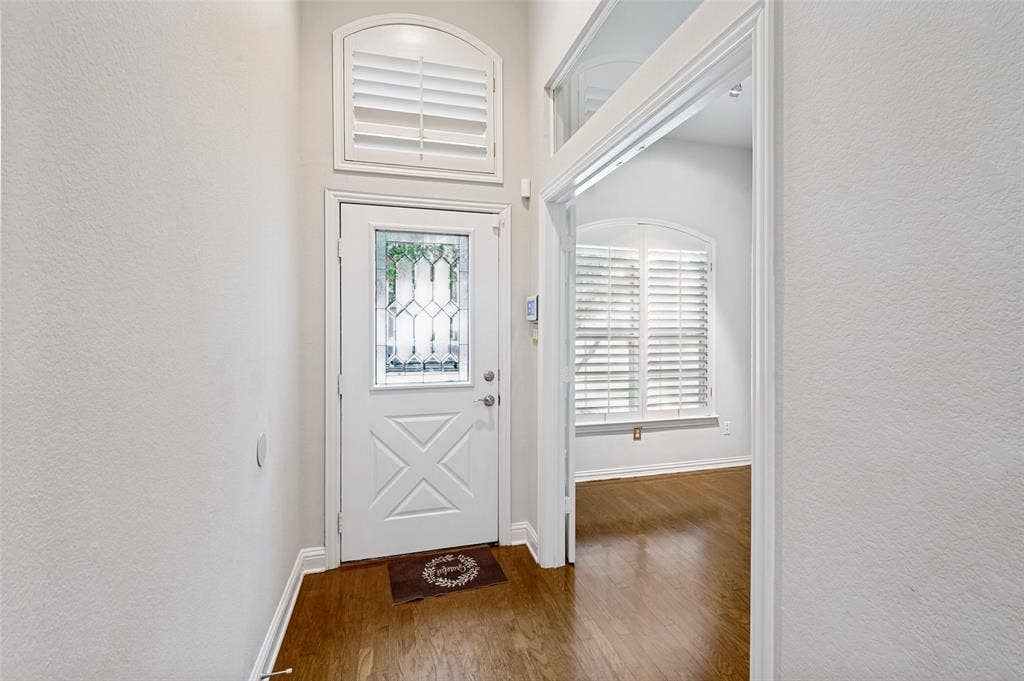 8012 Springmoss Drive, Plano, TX 75025 Tall ceilings and beautiful glass paneled door leads to front study room