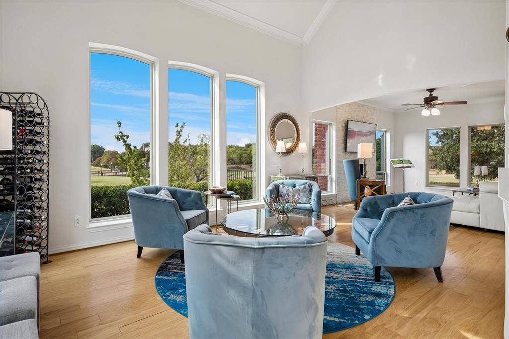 7501 Sweetgum Drive, Irving, TX 75063 Vaulted ceiling, multiple arched windows, wood-finish flooring, recessed lighting, and a ceiling fan