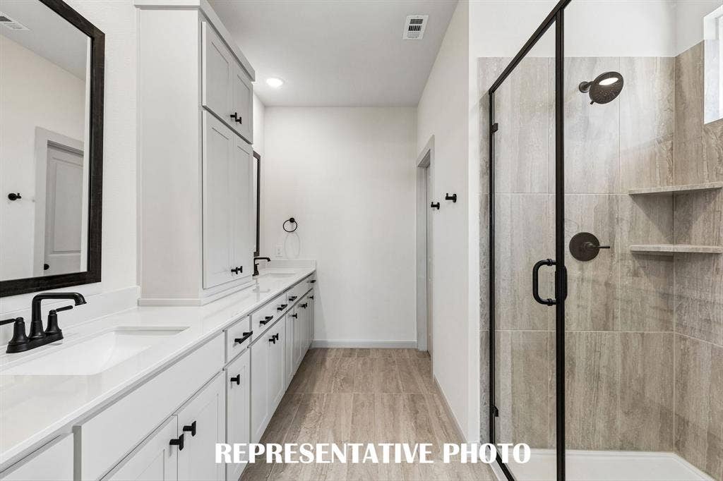 4629 Pointer Court, McKinney, TX 75071 You will love the spacious walk in shower in this beautiful owner's bath. REPRESENTATIVE PHOTO