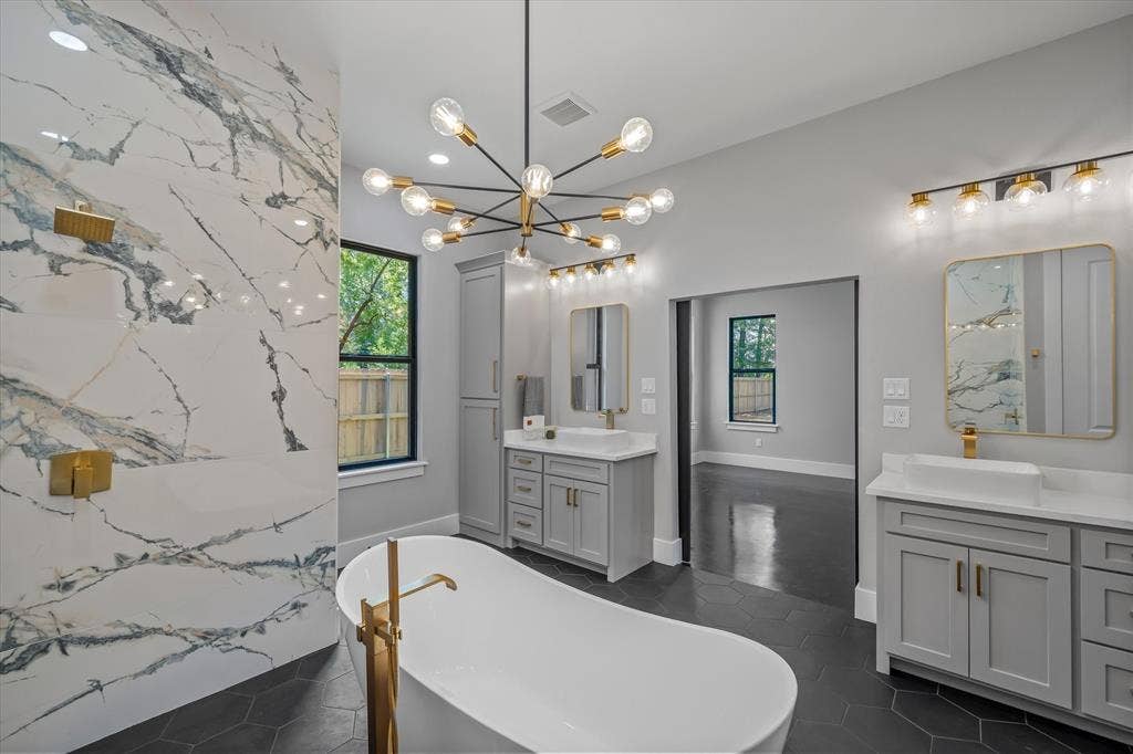 12253 Madison Xing, Bullard, TX 75757 Freestanding soaking tub with gold-finish floor-mounted faucet
