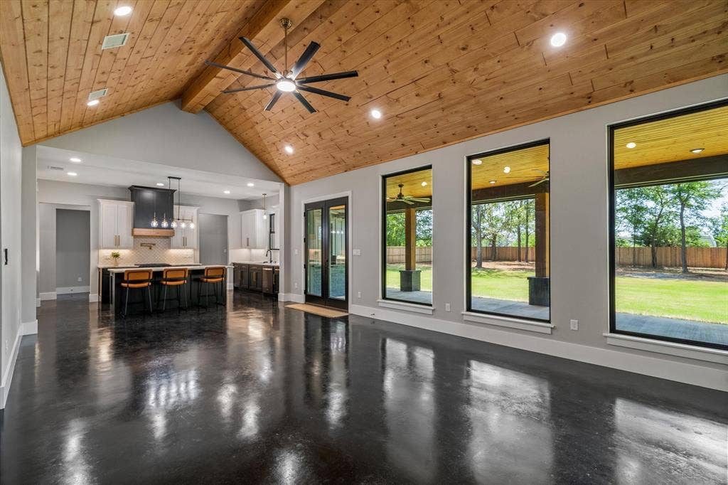 12253 Madison Xing, Bullard, TX 75757 Vaulted wood-paneled ceiling with recessed lighting and a ceiling fan