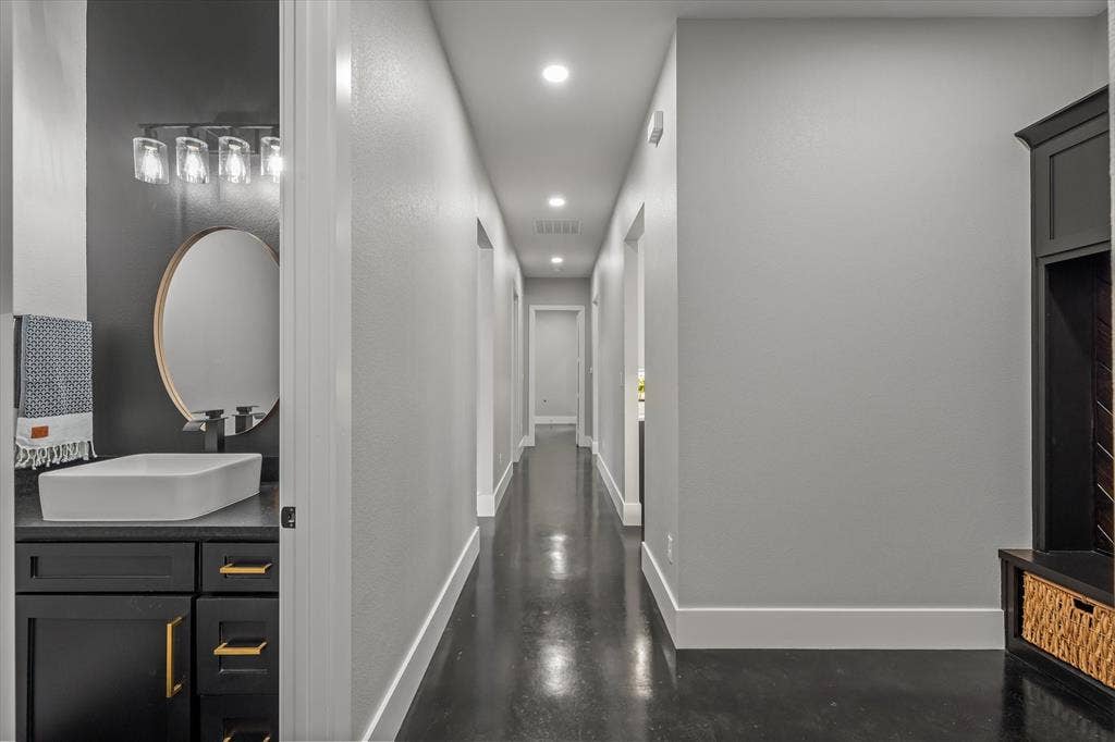 12253 Madison Xing, Bullard, TX 75757 Long hallway featuring recessed lighting and dark, polished flooring