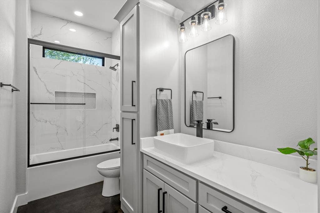 12253 Madison Xing, Bullard, TX 75757 Modern bathroom featuring a rectangular vessel sink, white countertop, and dark-finish hardware