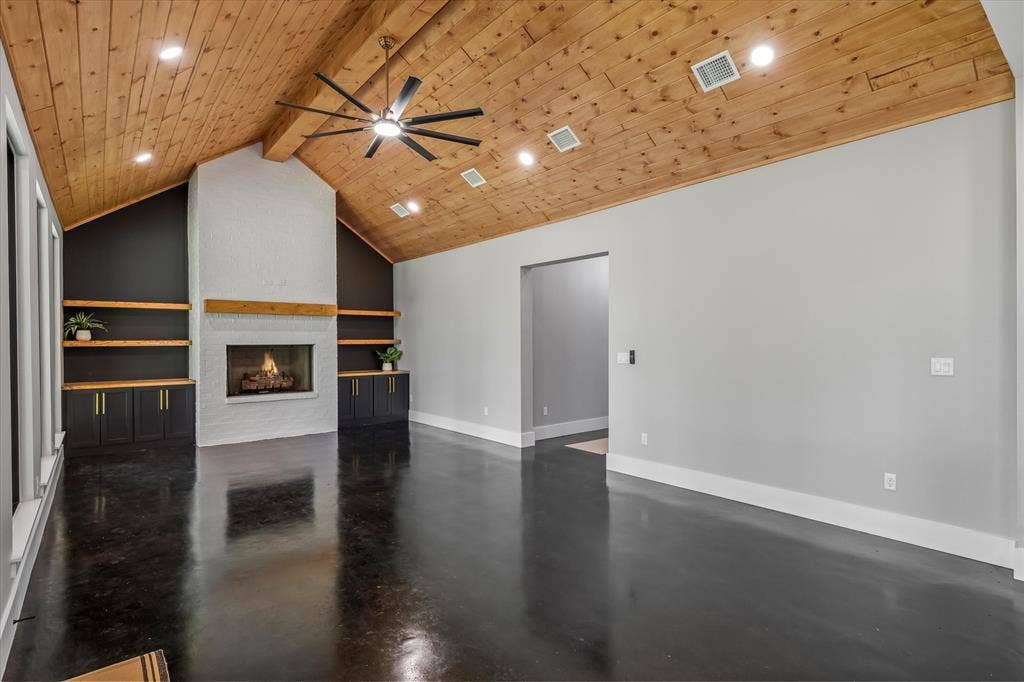 12253 Madison Xing, Bullard, TX 75757 Vaulted wood-plank ceiling with recessed lighting and a ceiling fan