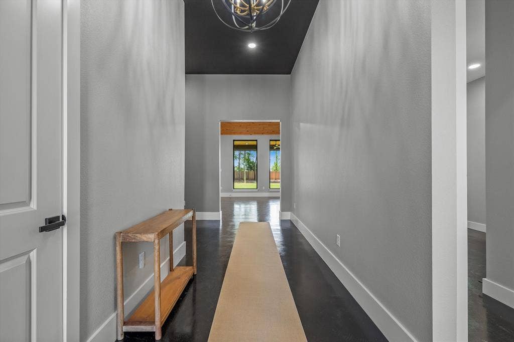 12253 Madison Xing, Bullard, TX 75757 Entryway featuring dark wood-finish flooring, light grey walls, and a recessed black ceiling