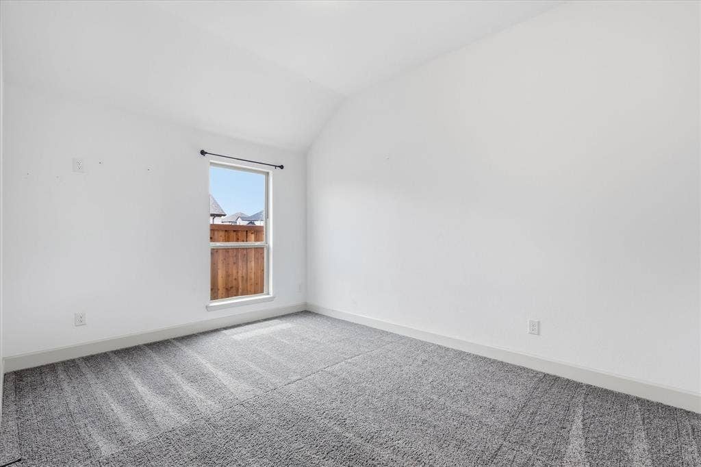 787 Cedarwood Court, Haslet, TX 76052 Room featuring vaulted ceilings and neutral-toned carpeting