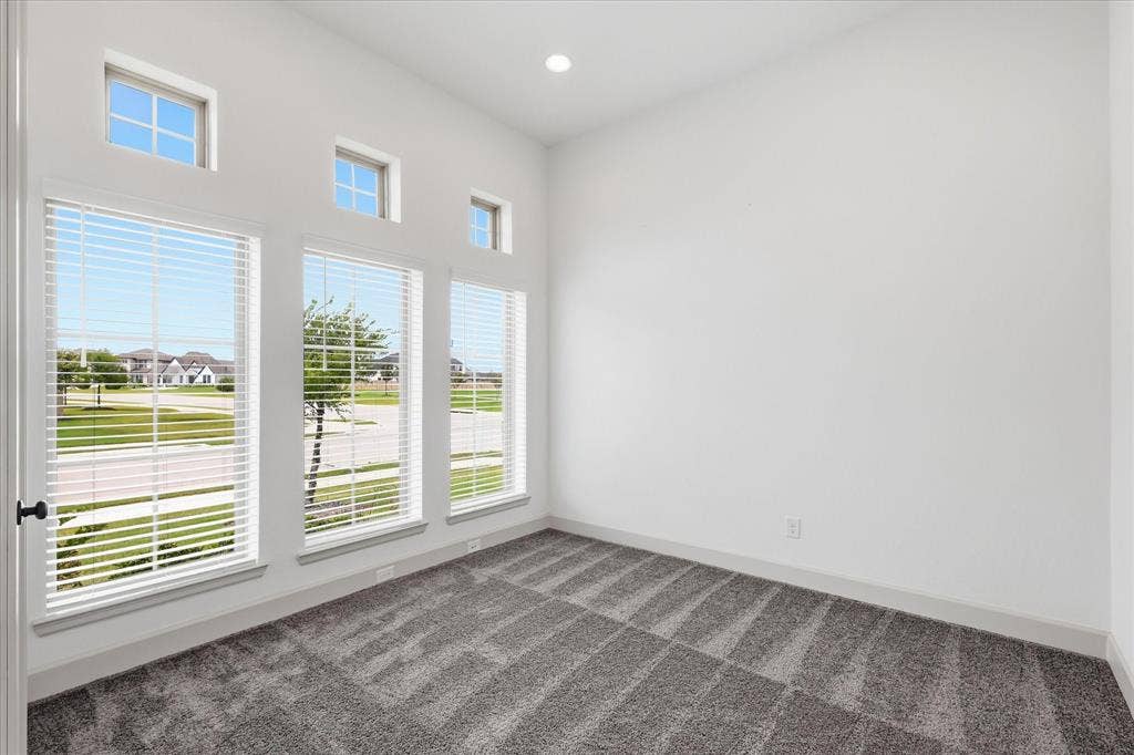787 Cedarwood Court, Haslet, TX 76052 Room with vaulted ceiling, featuring multiple large windows with white blinds