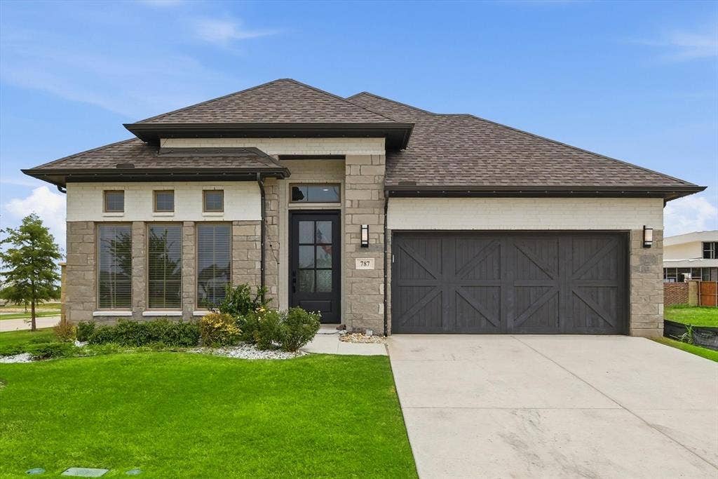 787 Cedarwood Court, Haslet, TX 76052 Stone and brick facade with a dark wood-finish garage door