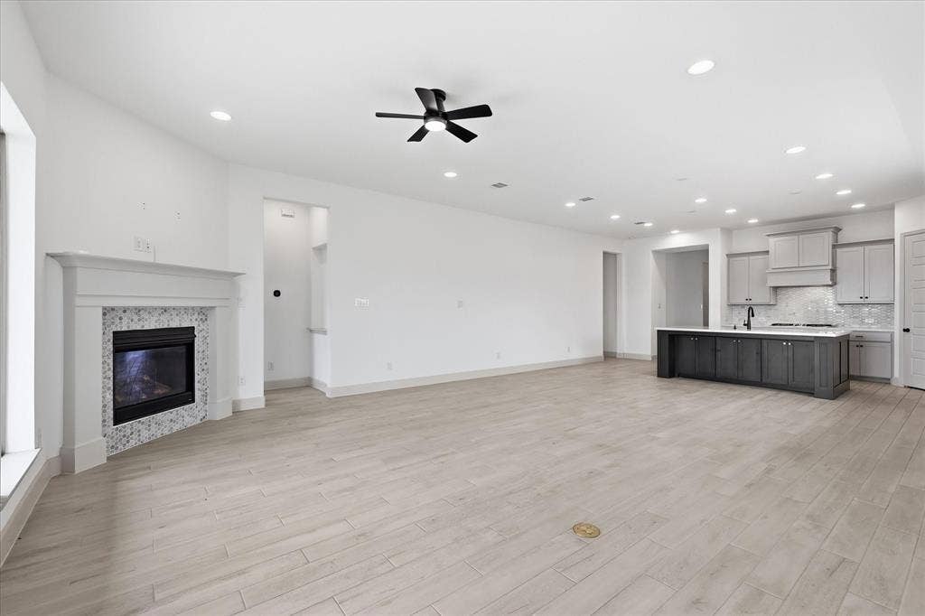 787 Cedarwood Court, Haslet, TX 76052 Expansive open-concept living area featuring light wood-finish flooring and recessed lighting