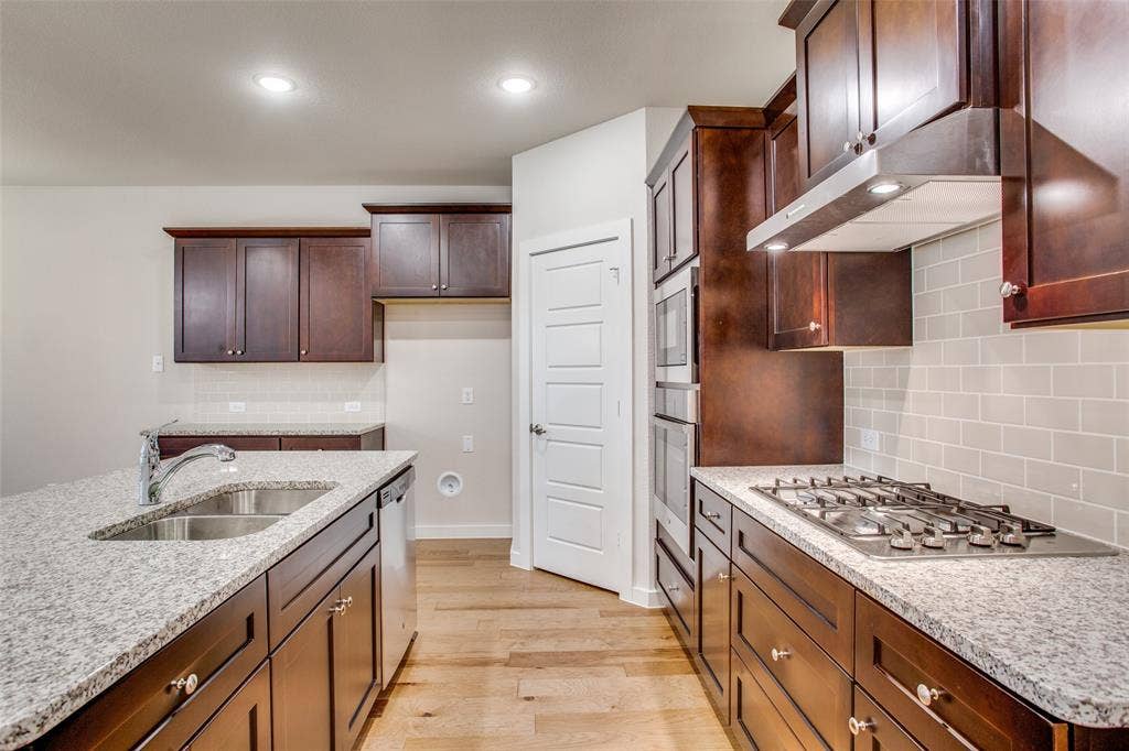 1432 Monarch Trail, Northlake, TX 76226 Granite counters and rich dark cabinetry