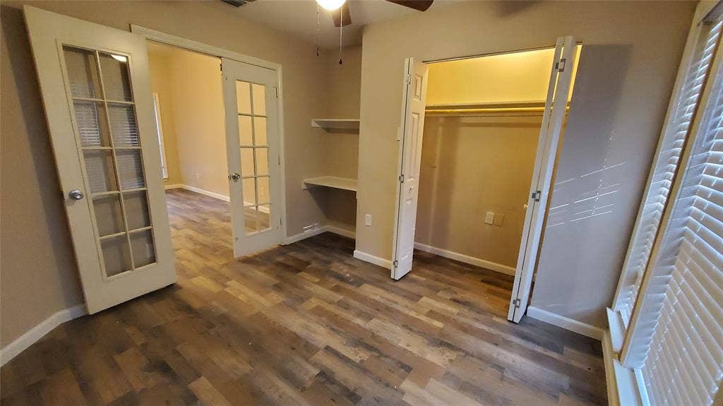 8440 Willow Creek Drive, Frisco, TX 75034 Bedroom 4 with ceiling fan, study desk, and french doors.