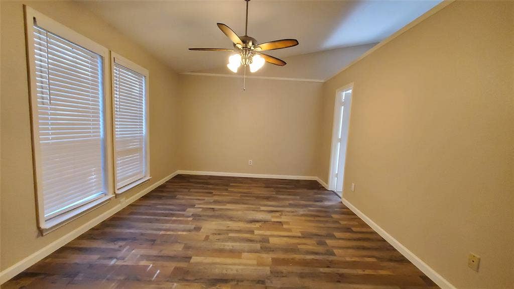 8440 Willow Creek Drive, Frisco, TX 75034 Unfurnished room with ceiling fan, lofted ceiling, and dark wood-type flooring