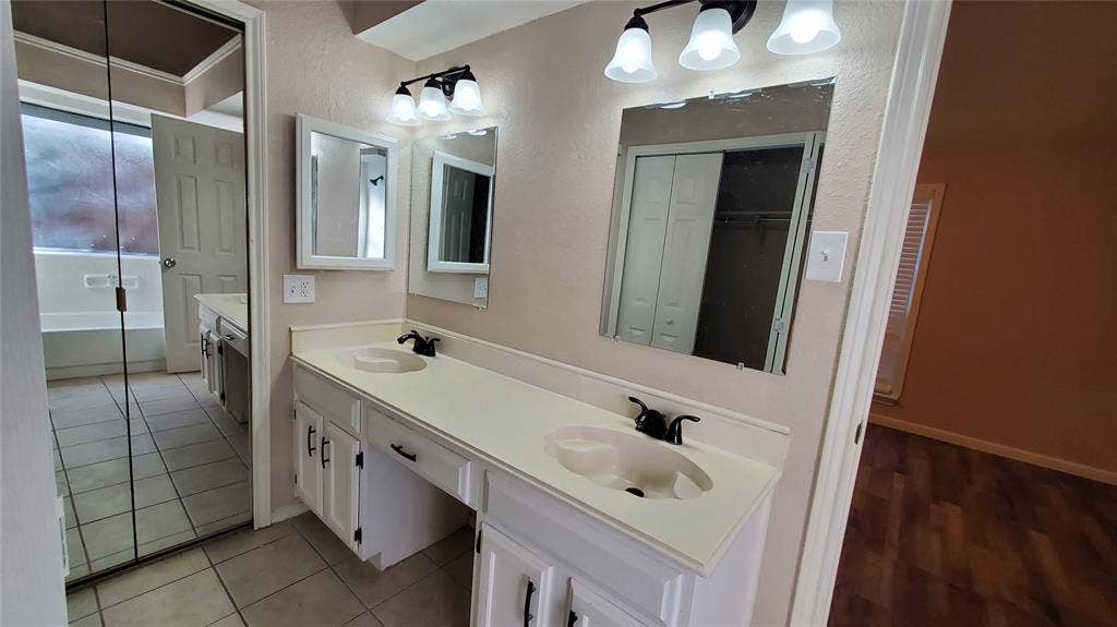 8440 Willow Creek Drive, Frisco, TX 75034 Bathroom featuring tile patterned floors and vanity