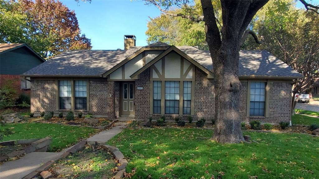 8440 Willow Creek Drive, Frisco, TX 75034 Tudor house with a front yard