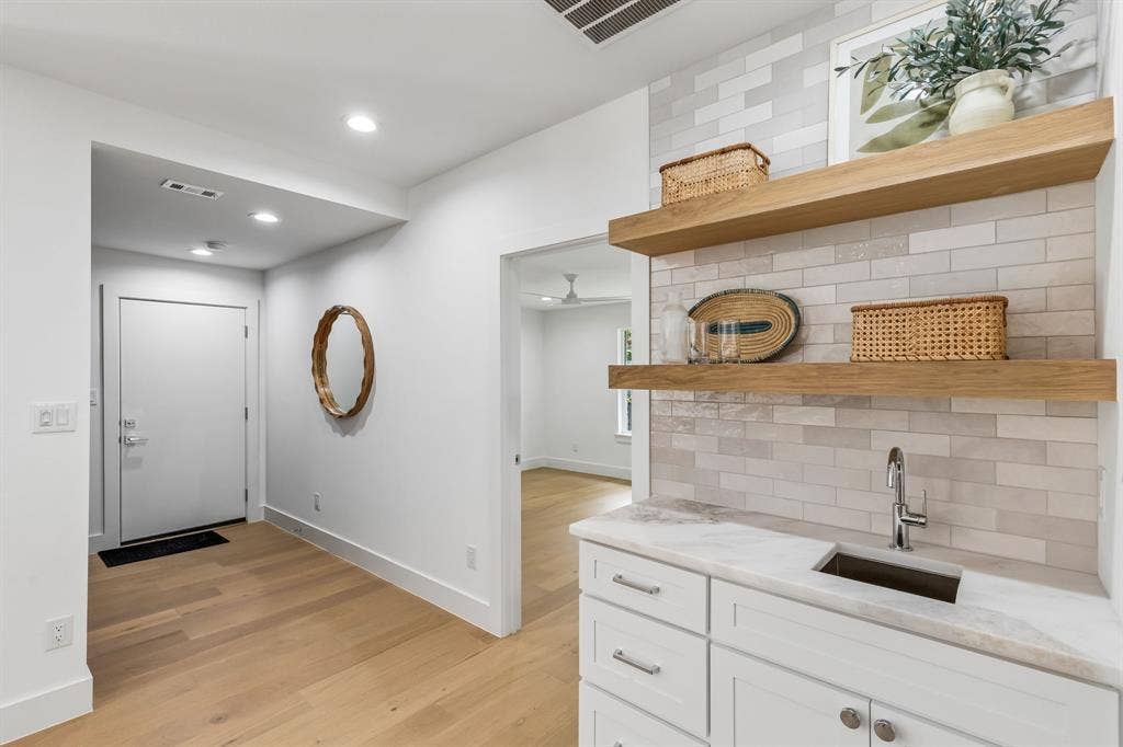 7124 Meadow Road, Dallas, TX 75230 Wet bar easily accessible from all your entertainment areas