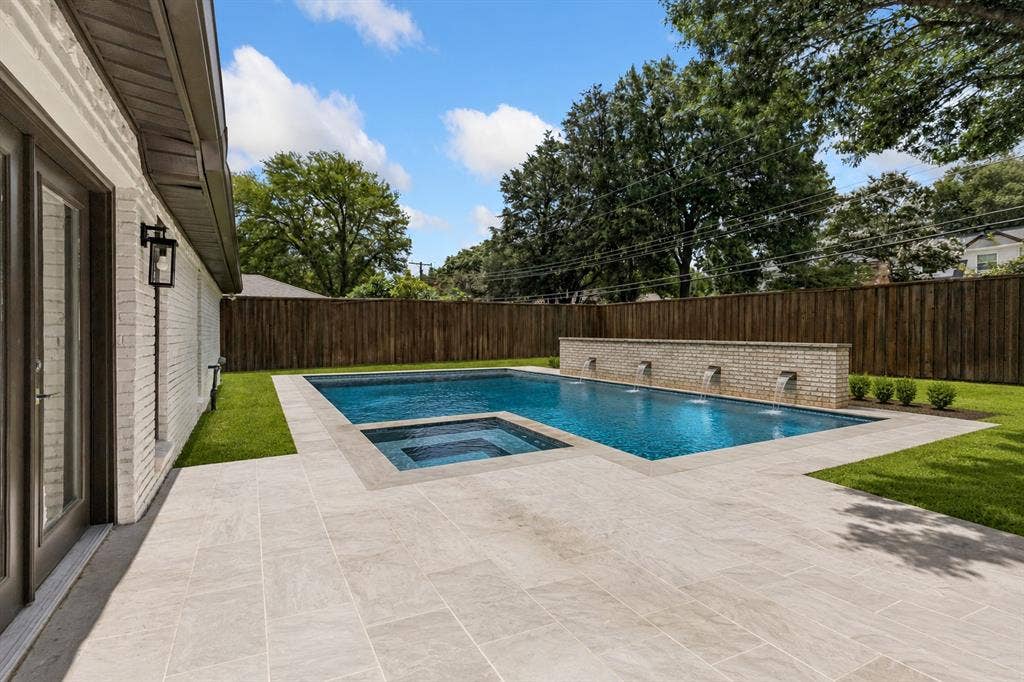 7124 Meadow Road, Dallas, TX 75230 Imagine a beautiful pool in the backyard. Photo is virtually enhanced with pool rendering created by AI.
