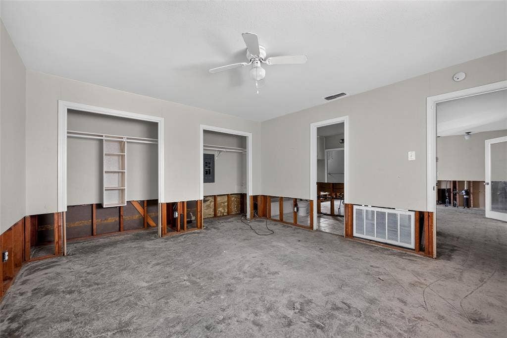 600 Terrace Drive, DeSoto, TX 75115 Interior space featuring a ceiling fan, exposed wall framing, and a concrete subfloor