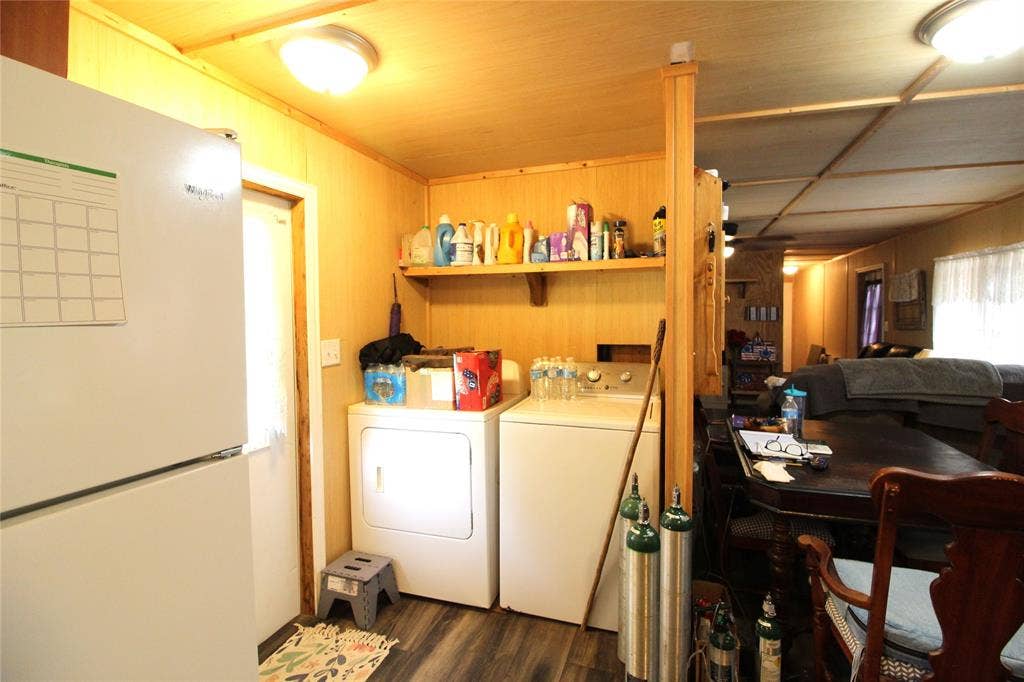 921 Crown Drive, Tool, TX 75143 Utility area with wood-finish flooring, paneled walls, and a built-in shelving unit