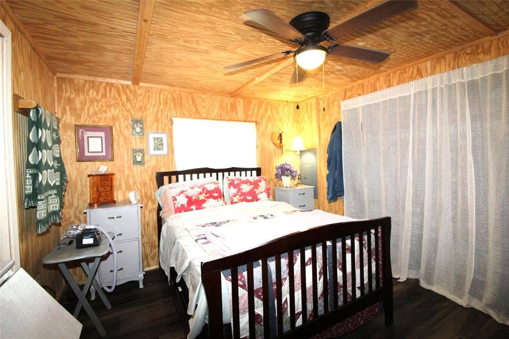 921 Crown Drive, Tool, TX 75143 Interior room featuring wood-finish walls and ceiling