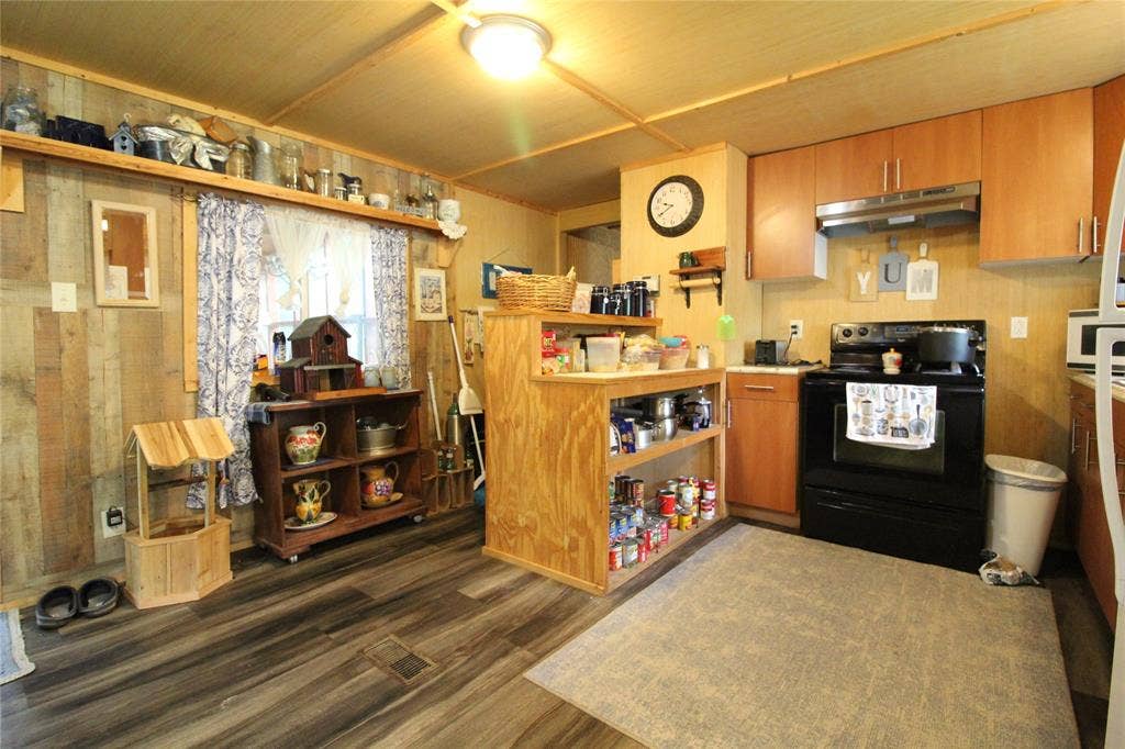 921 Crown Drive, Tool, TX 75143 Kitchen featuring wood-finish flooring, wood plank paneling, and wood ceiling planks