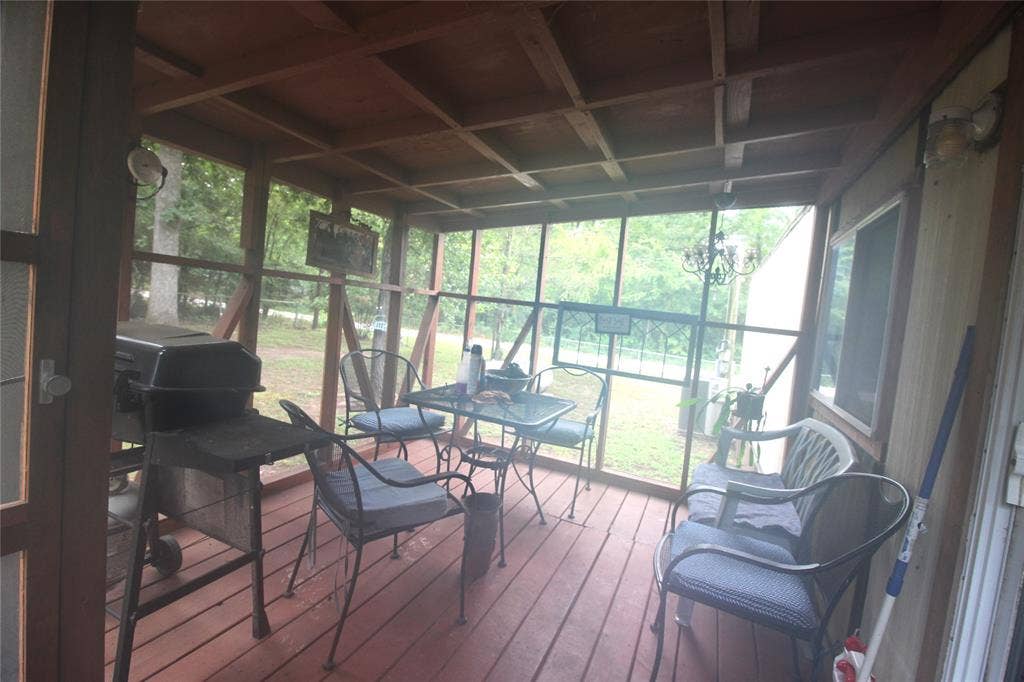 921 Crown Drive, Tool, TX 75143 Screened-in porch featuring a wood-finish floor and exposed beam ceiling