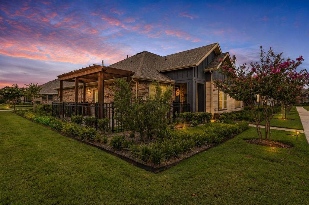 Twilight view of the corner lot of 1005 4th St, Argyle, TX in Harvest in Denton County, Texas