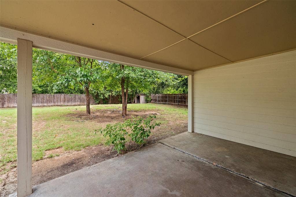 1005 Keller Avenue, Benbrook, TX 76126 Just envision the pretty string lights and patio furniture!